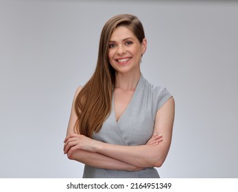 Smiling woman in gray business dress standing with crossed arms, isolated female portrait. - Shutterstock ID 2164951349