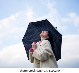 A Smiling Woman Happy Rain. Sky Background. Life. Lifestyle. Happy Day. 
