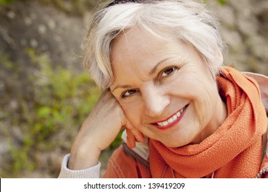 Smiling Woman In Her 60s Outdoors