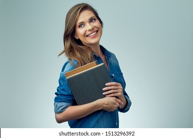 Smiling woman holding books. isolated portrait of school teacher. - Shutterstock ID 1513296392