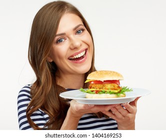 Smiling Woman Holding Burger On White Plate. Studio Isolated Female Portrait With Fast Food.