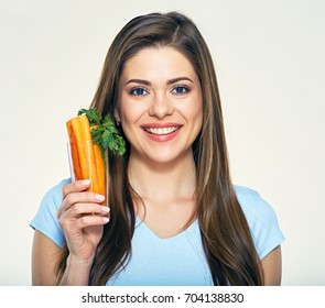 Smiling Woman Holding Carrot Stick In Glass. Smile With Teeth.