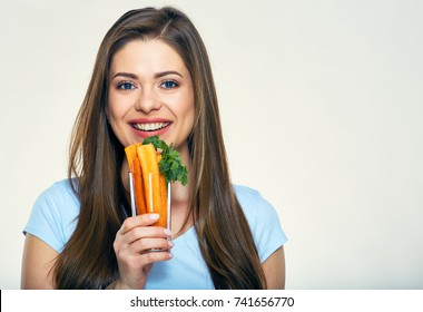 Smiling Woman Holding Carrot Stick In Glass. Smile With Teeth.