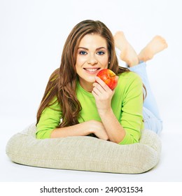 Smiling Woman Holding Red Apple Lying On A Floor. Big Smile With Teeth. White Background Isolated.