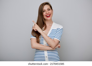 Smiling Woman Isolated Portrait. Girl In White Dress Pointing Finger At Side Away.