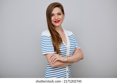 Smiling woman isolated portrait. Girl in white dress with blue stripes standing with arms crossed. - Shutterstock ID 2171202745