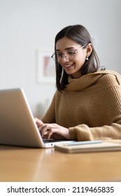 Smiling Woman With Laptop In Home Office.