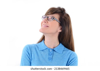 Smiling woman looking up on copy space. Closeup of happy Caucasian female business woman isolated on white background.