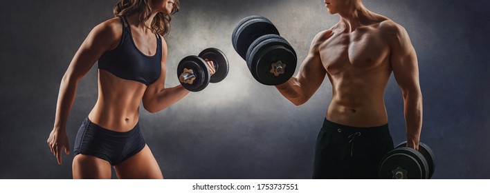 Smiling Woman An Man With Dumbbell - Successful Fitness Studio 