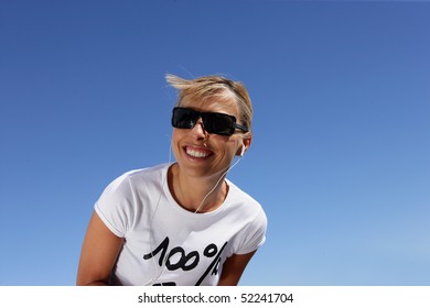 Smiling Woman With Mp3 Walkman And Sunglasses