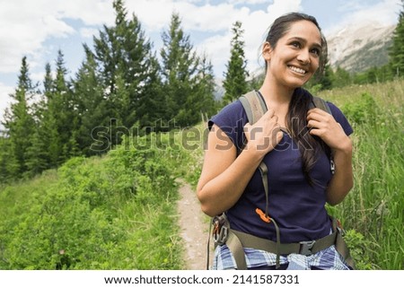Smiling woman on hiking trail