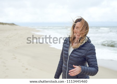 Similar – Pretty healthy woman enjoying a hike on a beach