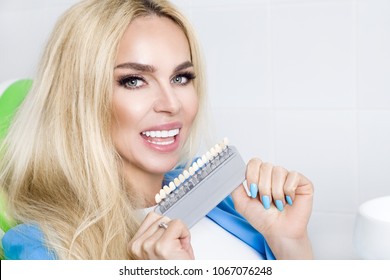 Smiling Woman With Perfect Teeth Over White Background. Whitening Concept. Porcelain Veneers. Dentistry.