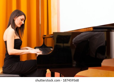 Smiling woman playing piano