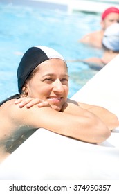 Smiling Woman At The Pool Edge Wear Black Swimming Cap 