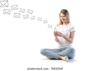 Smiling Woman Sending Sms From A Mobile Phone