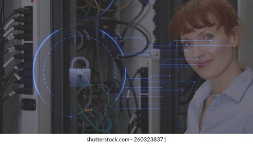 Smiling woman in server room working on cybersecurity with digital lock interface. technology, data protection, IT professional, network, digital security, encryption - Powered by Shutterstock - Get 15% off with code: PIKWIZARD15