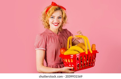 Smiling Woman With Shopping Basket With Groceries In Supermarket. Buying Spree.