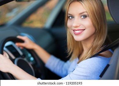 Smiling Woman Sitting In Car