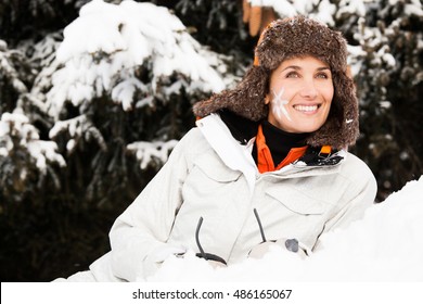 Smiling Woman In The Snow With A Small Sun Drawing On The Cheek