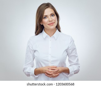 Smiling Woman Standing With Folded Hands. Isolated Portrait On White.