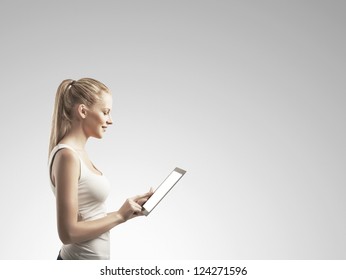 Smiling woman with tablet computer - Powered by Shutterstock