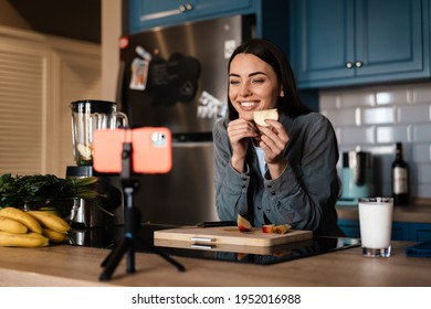 Smiling Woman Taking Selfie Footage With Apple On Cellphone At Home Kitchen