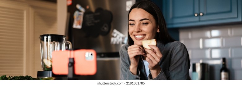 Smiling Woman Taking Selfie Footage With Apple On Cellphone At Home Kitchen