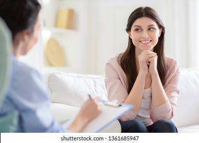 Smiling woman talking to wellness coach about motivation and happiness, free space