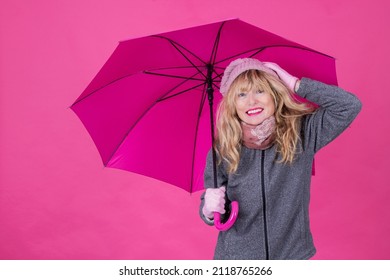 smiling woman with umbrella isolated on background