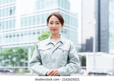 Smiling Woman In Work Clothes