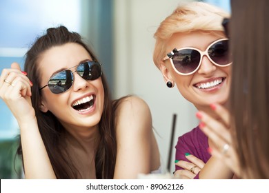 Smiling women - Powered by Shutterstock