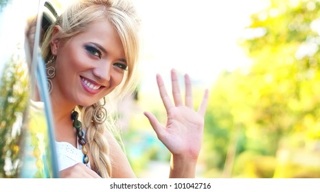 Smiling Women Wave Goodbye