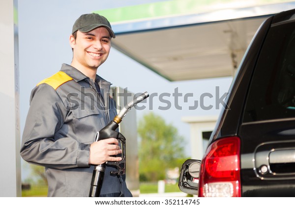 Smiling worker at the gas\
station