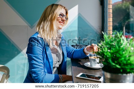 Similar – Working girl stiring coffee