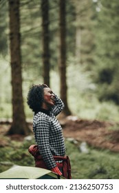 Smiling Young African American Woman Standing By Her Tent After A Night Camping In The Woods