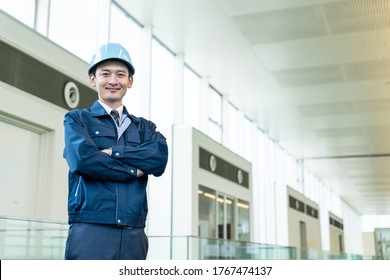 Smiling Young Asian Engineer In The Building.