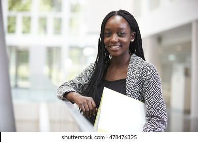 Smiling Young Black Female Student In University Foyer