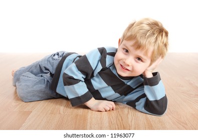 Smiling Young Boy Laying Down