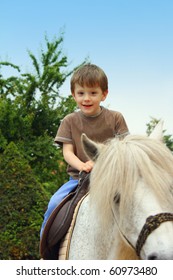 Smiling, Young Boy Ride A Pony Horse