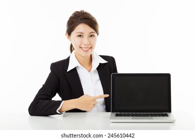 Smiling Young Business Woman  Showing And Pointing To The Laptop 