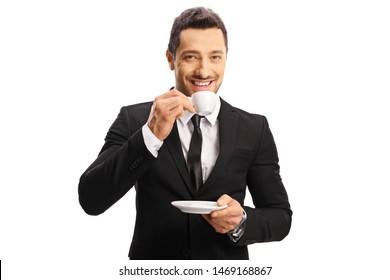 Smiling Young Businessman Drinking Espresso Coffee And Looking At The Camera Isolated On White Background