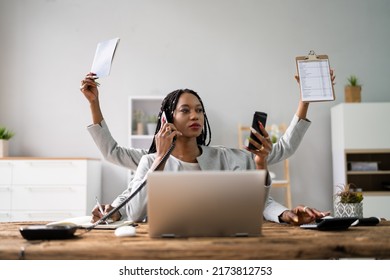 Smiling Young Businesswoman Doing Multitasking Work At Workplace - Shutterstock ID 2173812753