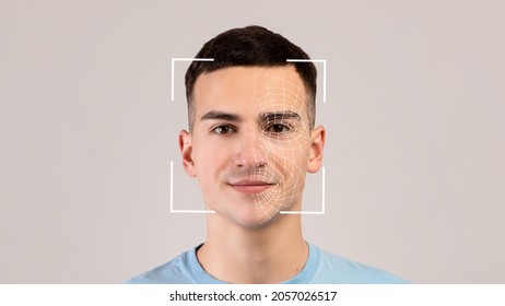 Smiling young caucasian male, double exposure with id scan, isolated on light background. Futuristic and technological face scanning for face recognition and person. Personal safety, future, security