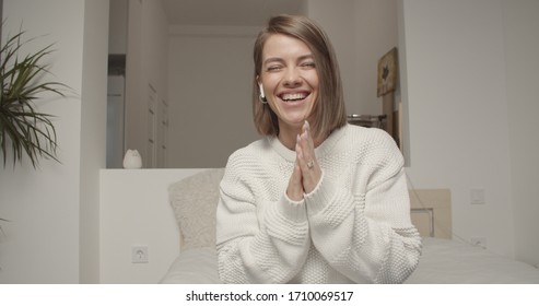 Smiling young caucasian woman blogger vlogger influencer sit at home speaking looking at camera talking make video chat, conference call record lifestyle blog vlog, webcam view