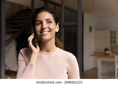 Smiling Young Caucasian Woman Talk Speak On Smartphone Using Wireless Mobile Provider Connection. Happy Millennial Female Have Pleasant Cellphone Call On Cellphone. Communication, Technology Concept.