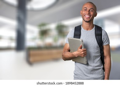 Smiling Young College Student With Laptop