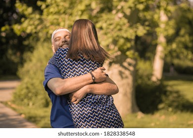 Smiling Young Couple Hugging, Upper Body Shot.