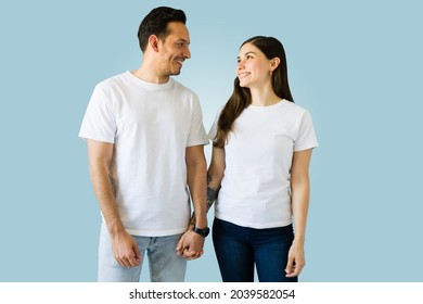 Smiling Young Couple In Love Face To Face With White Matching T-shirts. Loving The New Print T Shirts