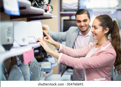 Smiling young customers purchasing toaster in domestic appliances section - Shutterstock ID 354760691